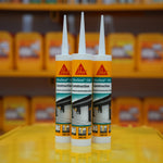 Two tubes of Sika construction sealant in front of shelves with more sealant bottles.