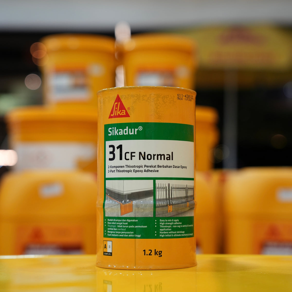 Sika adhesive can with blurred storage containers in the background
